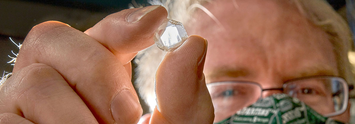 Dr. Timothy Grotjohn holds a manufactured diamond